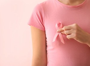 A woman with her hands on her chest