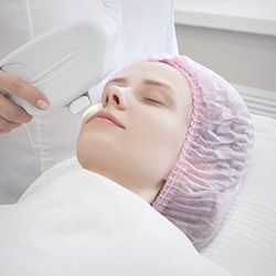 Woman receiving scar treatment