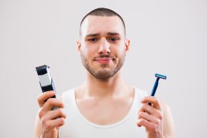 man holding razors