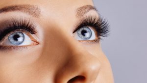 a woman with blue eyes and eyelash extensions